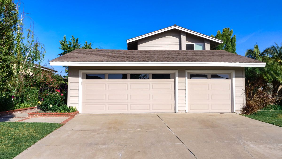 Suburban house exterior with double garage door